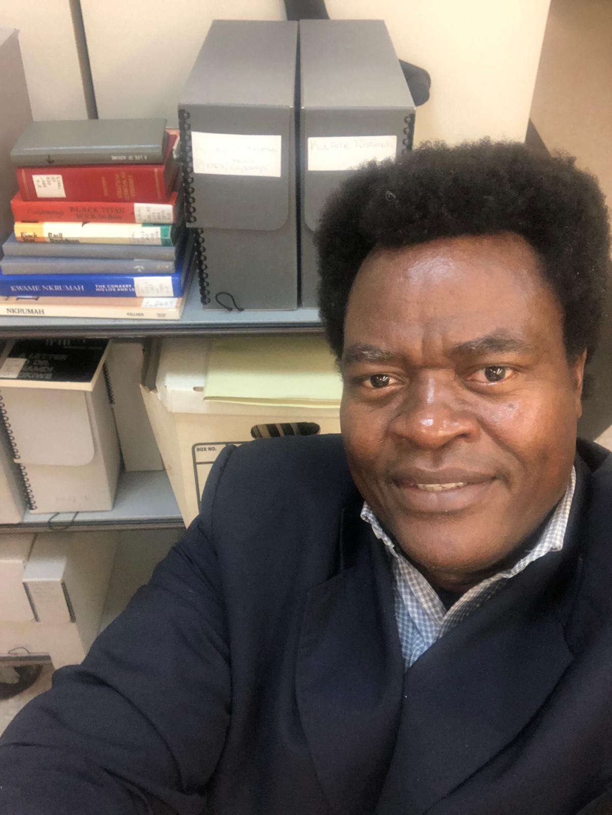 François Kodena photographed in a research and archival setting