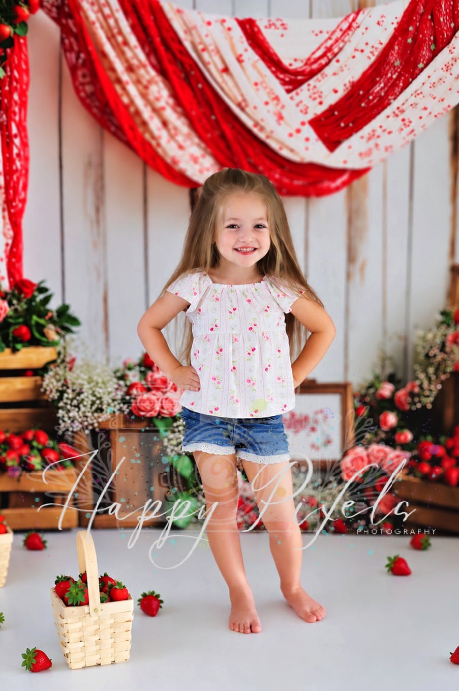 Young girl at a floral themed portrait setup