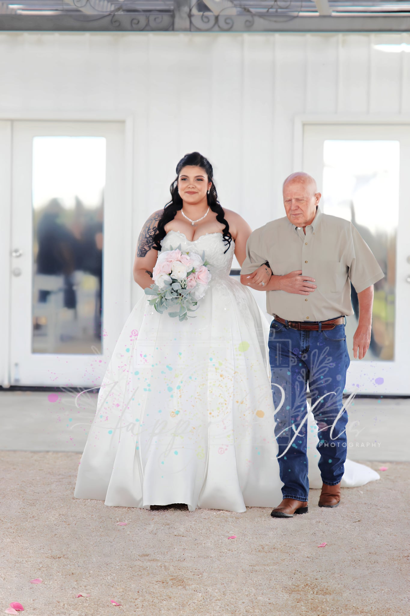 Bride walking in with her father before the ceremony
