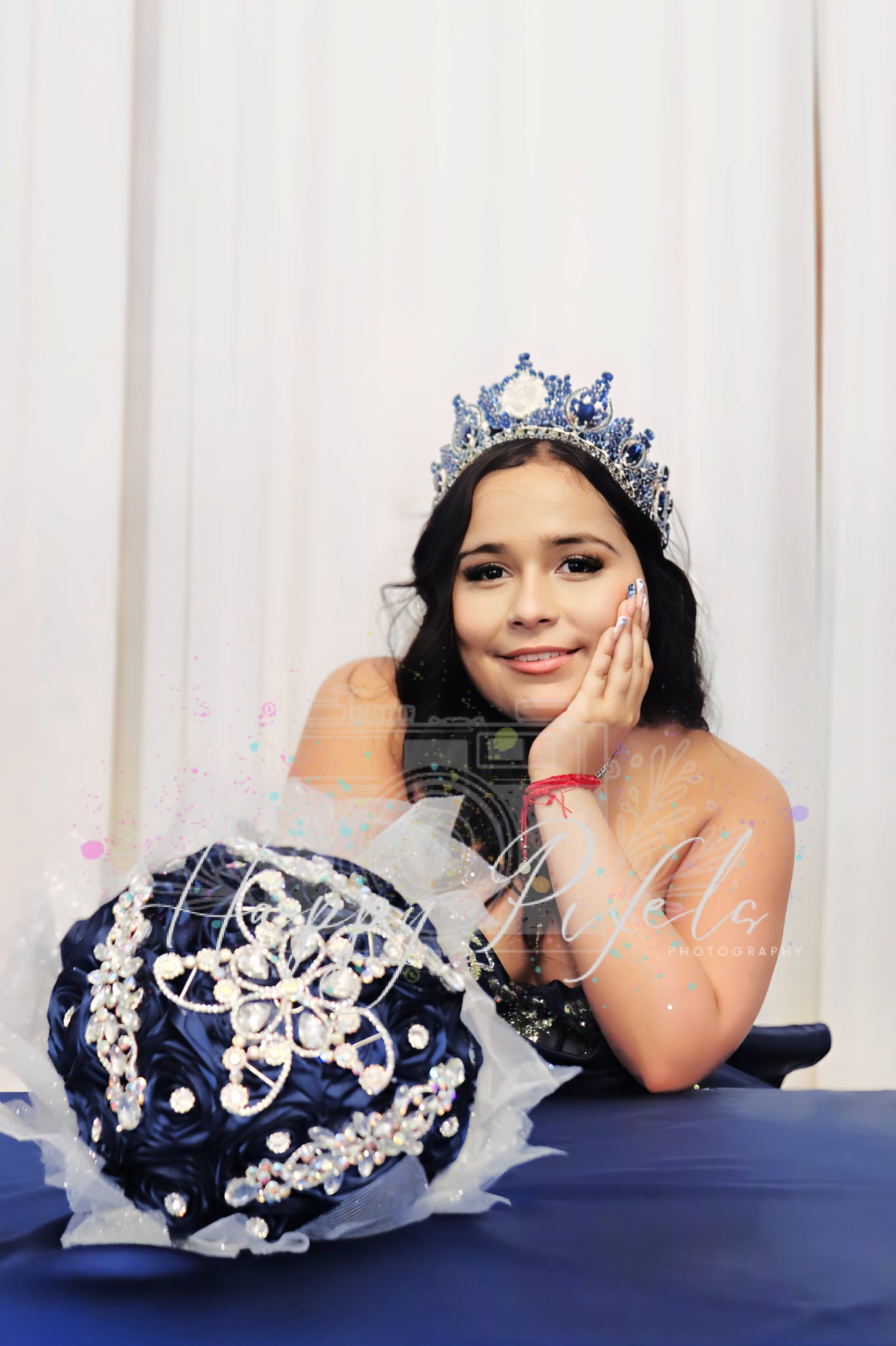 Quinceañera portrait with crown and bouquet