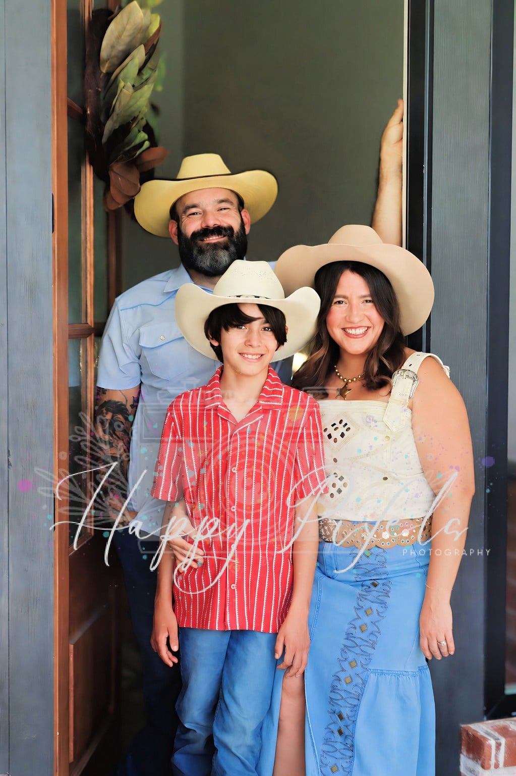 Family of three photographed in a doorway