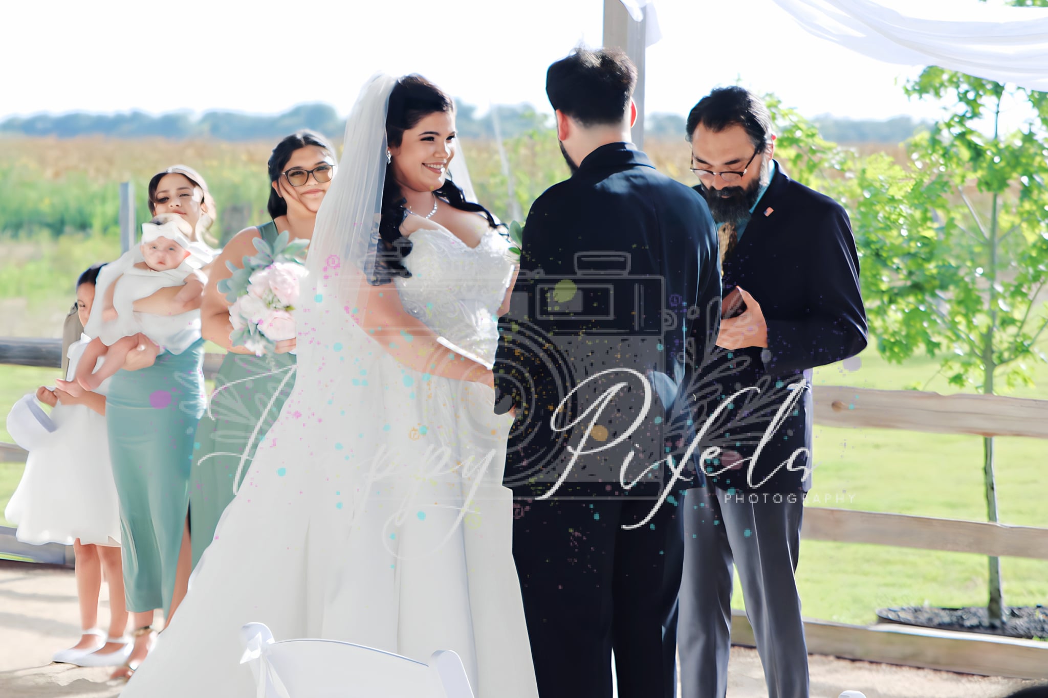 Wedding party gathered outdoors after the ceremony