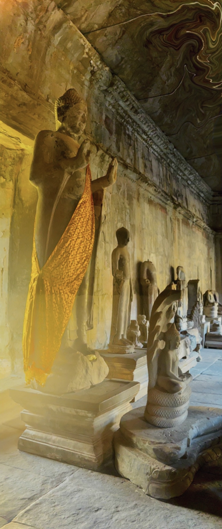 Row of seated Buddha statues along a temple gallery