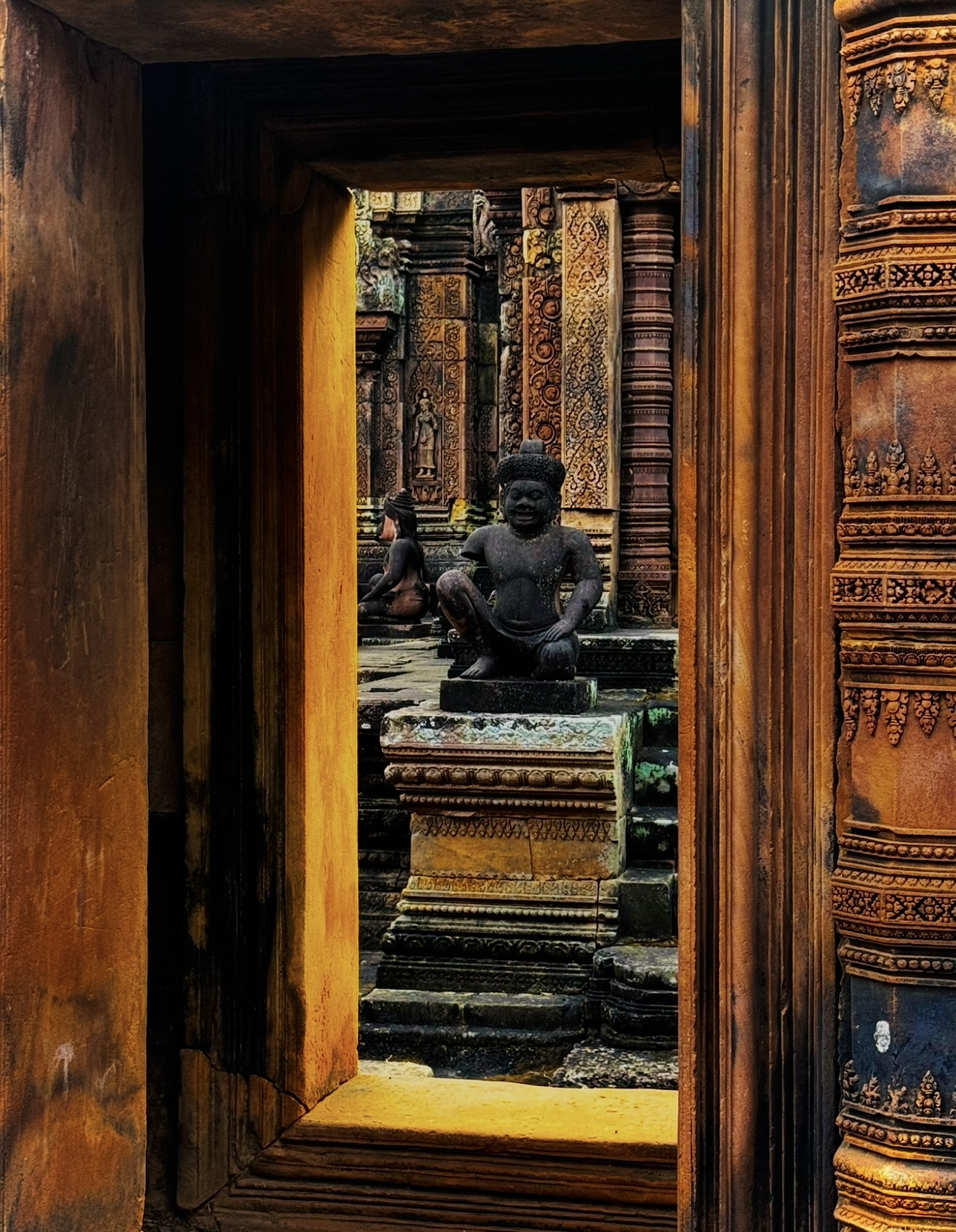 Temple doorway framing a stone guardian