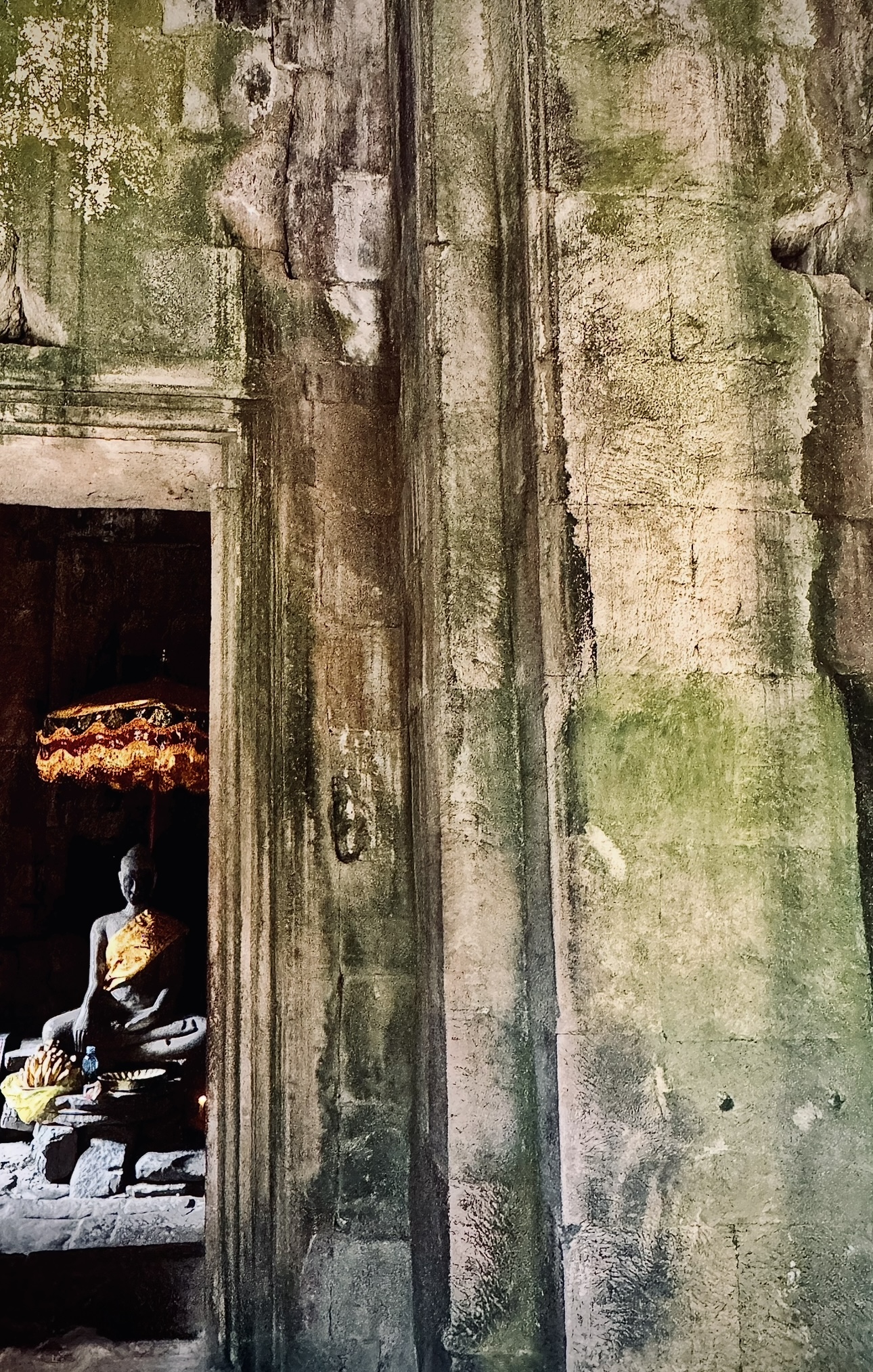 Ancient temple corridor with golden offerings