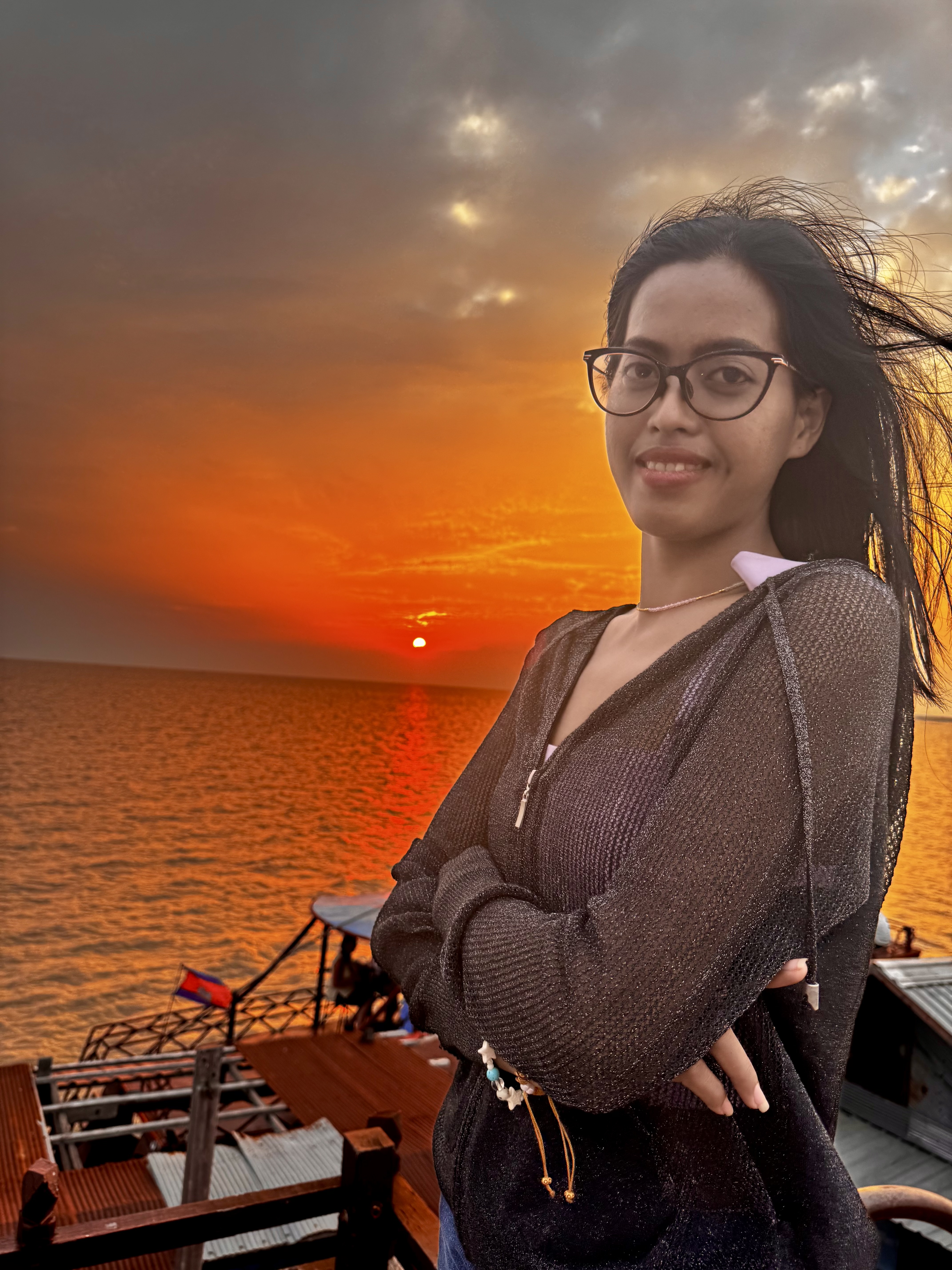 Guest enjoying a golden sunset from the boat deck