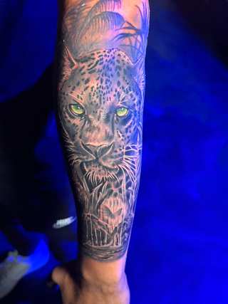 Portrait tattoo in black and grey shading