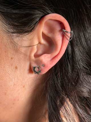 Body piercing jewelry placement close up